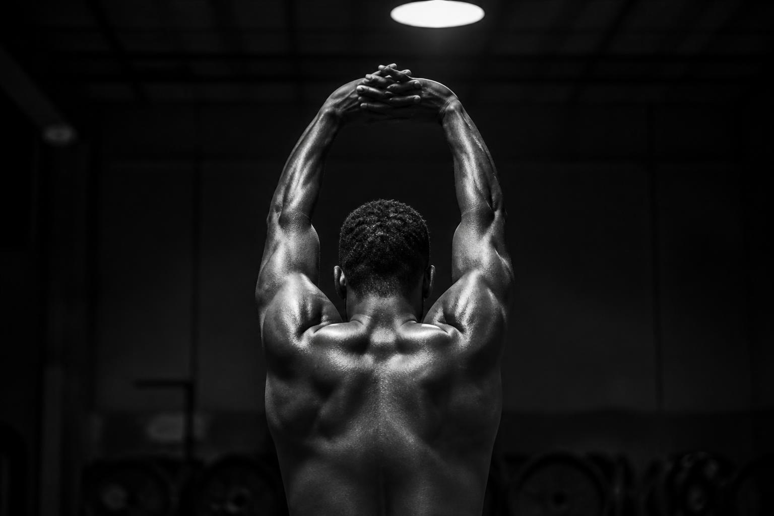 Back silhouette stretching overhead